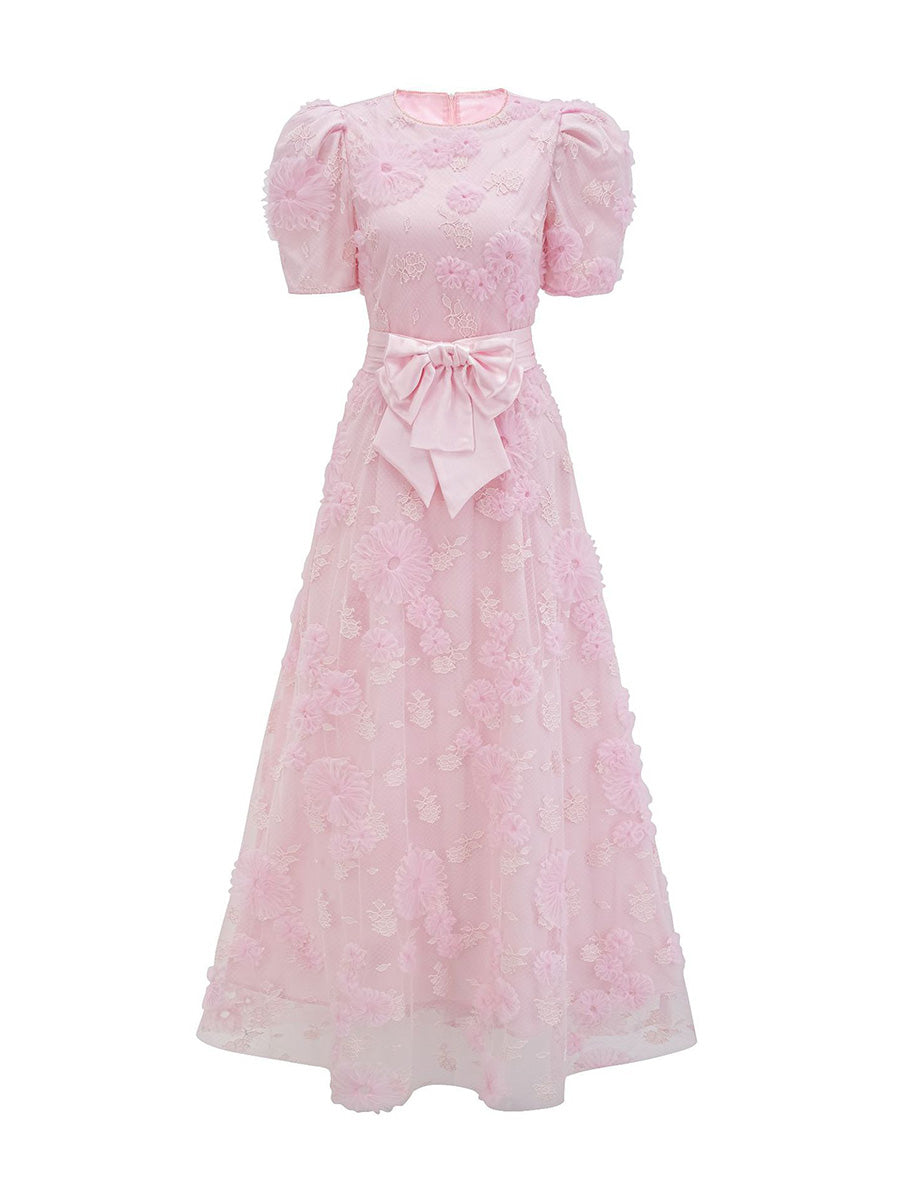 Pink dress with puff sleeves and a bow on a white background