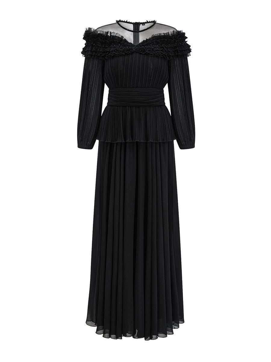 Black round neck dress with ruffled details on a white background