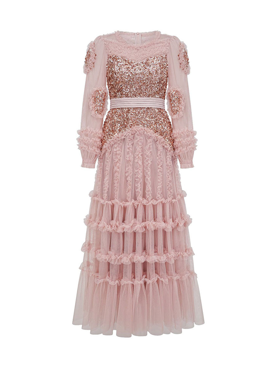 Pink tulle dress with sequin details on a white background