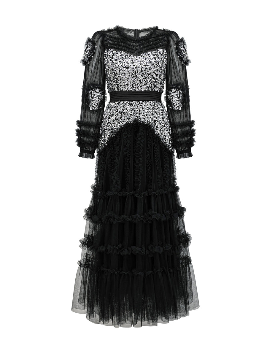 Black and silver dress with intricate detailing on a white background