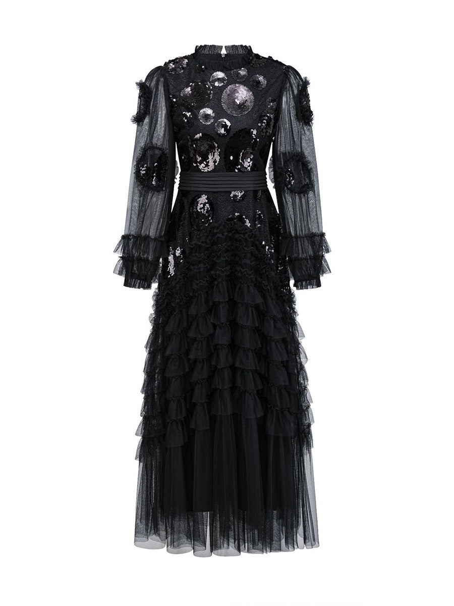Black dress with intricate detailing on a white background
