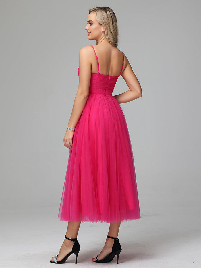 Chic spaghetti straps tulle tea length wedding guest dress in a soft flowing fabric